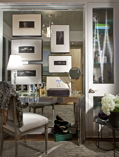 Whoever thought to hang pictures on a floor-length mirror? What a great idea. (Cayley Barrett Associates, LTD)