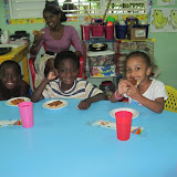 Renaldo, Wilner, Profe Narolin and Heidi love their pizza!