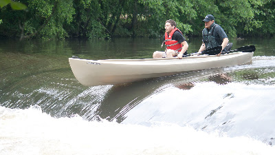 2 guys who are not members of the HRCKC demonstrating the double gunnel grab going over the dam below Ramapo Reservation