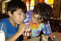 The boys enjoying a milkshake at Cafe Slavia - one of Prague's grand old cafes