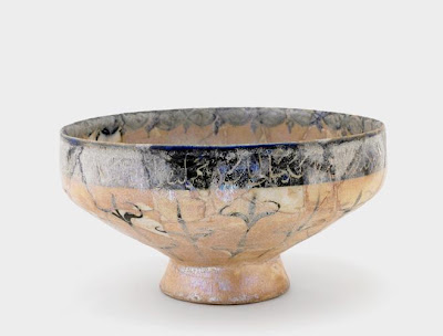 Footed bowl | Origin:  Kashan,  Iran | Period: 12th century  Saljuq period | Details:  Not Available | Type: Earthenware painted with glaze | Size: H: 10.6  W: 20.2  cm | Museum Code: S1997.111 | Photograph and description taken from Freer and the Sackler (Smithsonian) Museums.