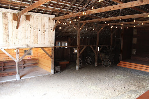 The inside. Because the place is still new, the to-do list isn't completely checked off. Come the spring, this will have a concrete floor, bird-proofed ceiling, and a vintage bar. There's a great stage on the right for a band or sweetheart table, too. The inside. Because the place is still new, the to-do list isn't completely checked off. Come the spring, this will have a concrete floor, bird-proofed ceiling, and a vintage bar. There's a great stage on the right for a band or sweetheart table, too.