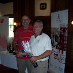Fred Hamood presenting Jim McBride with a bottle of O'Leary Walker Wine for winning 'the person who needs to improve the most next time'!