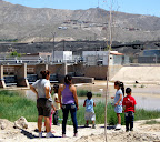 Mexicans at Rio Bravo with El Paso and UTEP across as borderpatrol watches.