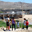 Mexicans at Rio Bravo with El Paso and UTEP across as borderpatrol watches.