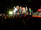 He had 20 people on stage mobbing him but still played.
