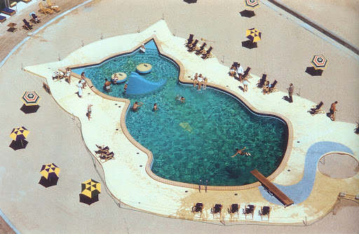 Pools come in all sorts of clever shapes, but this is the most whimsical I've ever seen. Fontainbleau Hotel, Miami, Florida, 1955. (Poolside with Slim Aarons, Abrams) Pools come in all sorts of clever shapes, but this is the most whimsical I've ever seen. Fontainbleau Hotel, Miami, Florida, 1955. (Poolside with Slim Aarons, Abrams)
