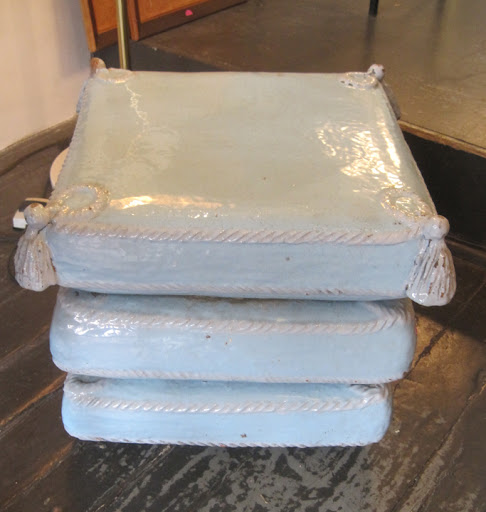 This crazy ceramic pillows table/stool was probably made in Italy in the 1950s.