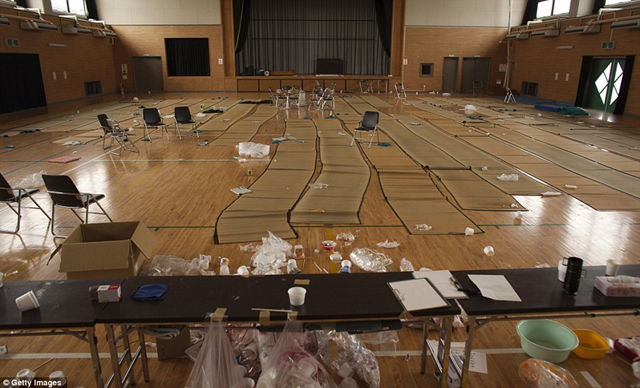 No time to clean: Mats and rubbish still litter the floor of an evacuation hall in Minamisoma, Japan, that was emptied after the order to leave the area was given. More than three months after the Fukushima nuclear plant was hit by a quake and tsunami that triggered the world's worst nuclear disaster since Chernobyl, Japanese officials are still struggling to understand where and how radiation released in the accident created far-flung "hotspots" of contamination. Getty Images / dailymail.co.uk