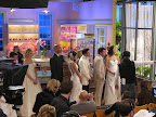 The models in their beautiful and handsome fashions await their cues. The models in their beautiful and handsome fashions await their cues.