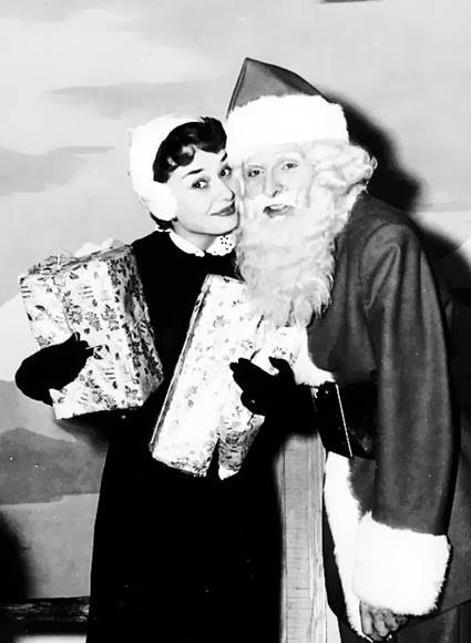 Audrey Hepburn and Santa 1955