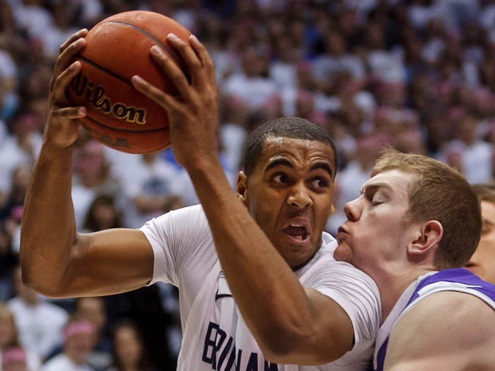 BYU forward Brandon Davies (0) drives on Portland forward Ryan Nicholas (32). BYU vs. Portland, college basketball Saturday, February 25, 2012 in Provo, Utah.