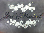 Lace applique and lettering pinned on paper