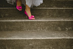 The first thing Alis decided when she began planning was that she wanted to wear pink shoes. After numerous purchases and returns (thanks to Zappos.com), she found the perfect pair by Kate Spade.