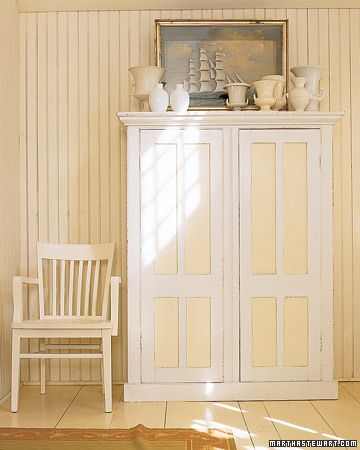 This cabinet is painted with varying shades of white and ivory to create contouring. This cabinet is painted with varying shades of white and ivory to create contouring.