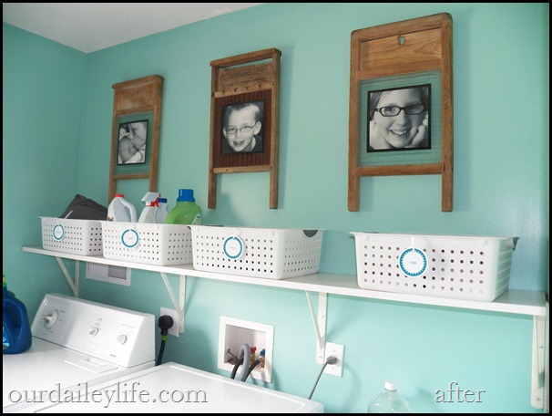 2012-05-26 11.46.19 laundry room, white baskets, teal walls, vintage washboards as picture frames