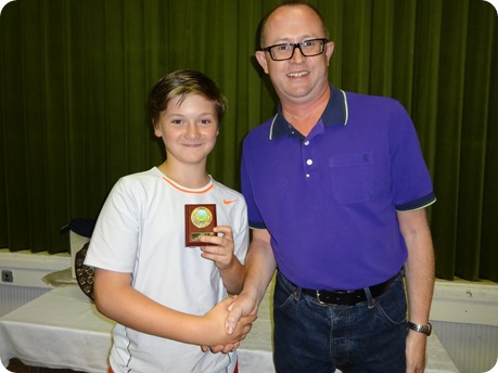 Junior winner Jack Whalley receives his shield from Alastair Bain WJTC Chairman