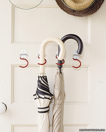Get dry umbrellas out the way by putting them on door hooks.
