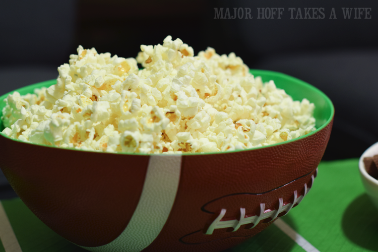 serve popcorn in a football bowl for a fun snack. Looking for a fun party for your teenage boy? Why not throw a Football video game party? Easy ideas for how to entertain kiddos during the Big Game. Features DiGiorno pizza, personalized football cups, free printable lanyards, and an incredible recipe for football shaped ice cream sandwiches! #GameTimeMVP #CollectiveBias #ad serve popcorn in a football bowl for a fun snack. Looking for a fun party for your teenage boy? Why not throw a Football video game party? Easy ideas for how to entertain kiddos during the Big Game. Features DiGiorno pizza, personalized football cups, free printable lanyards, and an incredible recipe for football shaped ice cream sandwiches! #GameTimeMVP #CollectiveBias #ad