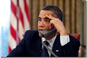 President Barack Obama makes a call from the Oval Office, May 29, 2009.   (Official White House Photo by Pete Souza)<br /><br />This official White House photograph is being made available for publication by news organizations and/or for personal use printing by the subject(s) of the photograph. The photograph may not be manipulated in any way or used in materials, advertisements, products, or promotions that in any way suggest approval or endorsement of the President, the First Family, or the White House. 