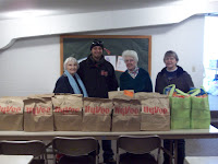 KCII's General Manager delivering food at the United Christian Baptist Church in Kalona