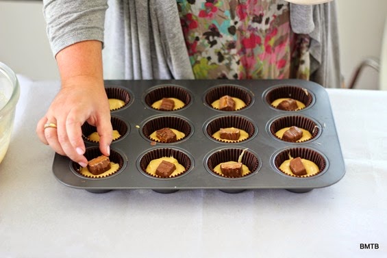 Mars Bar Cupcakes by Baking Makes Things Better - putting in the hidden mars bar bits