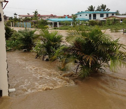 This photo from an Sydney Morning Herald reader shows floodwaters rushing down a local road in Fiji, 2 April 2012. Derrick Robinson