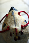 It smells like rubber and has a zipper and two handles.  It must be a chicken hand bag.