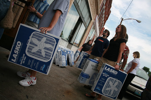 Drury University Graduate students who envisioned this fan drive carry the donations inside. (photo credit: James Mulvenon)