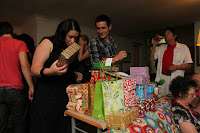 Rosey and Guy handing out the gifts