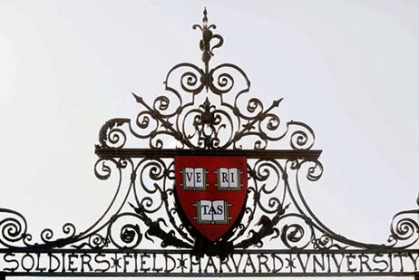 Harvard's seal sits atop a gate to the athletic fields at Harvard University in Cambridge, Massachusetts in this September 21, 2009 file photo. Harvard University is investigating allegations that approximately 125 undergraduate students cheated on a spring take-home final exam, school officials said on Thursday, disclosing what would be the largest cheating scandal in its recent history.  REUTERS/Brian Snyder/Files    (UNITED STATES - Tags: EDUCATION)