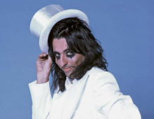 c0 Alice Cooper in top hat and white tuxedo; this is the Alice I remember from my youth.