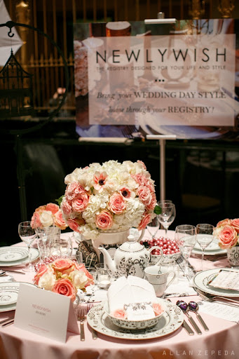 NewlyWish set stunning tables for our brides to admire complete with centerpieces, place cards, fine china, and menus.