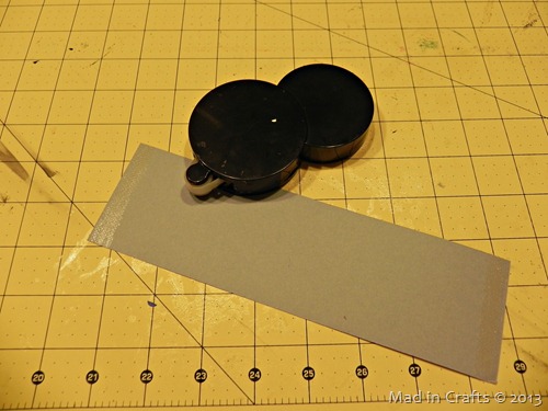 roll adhesive onto silver paper