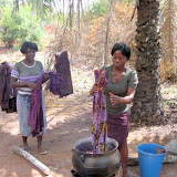 Dipping the fabric into the boiling water to remove the wax