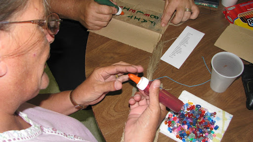 Betty McKelvy works on a bookmark.