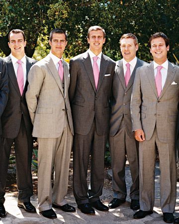 In a twist on the trend of having bridesmaids wear variations on a theme, this groom told his groomsmen to wear their own gray suits -- most of them own a few for work -- with matching pink ties. In a twist on the trend of having bridesmaids wear variations on a theme, this groom told his groomsmen to wear their own gray suits -- most of them own a few for work -- with matching pink ties.