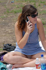 Girls using cell phones always forget to keep their legs closed
