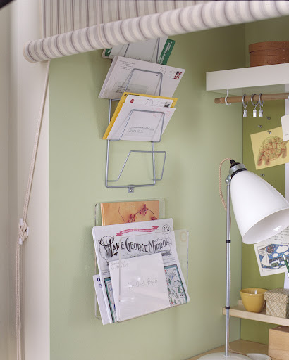 On the wall we used a pot lid holder as a mail sorter. If you're innovative, you can find office organization items anywhere. We often look in the kitchen or at hardware stores.