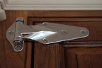 A heavy-duty commercial-grade refrigerator hinge