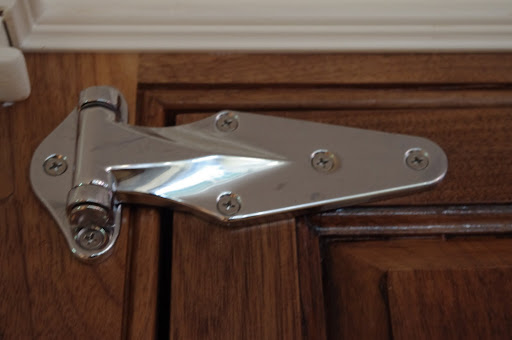 A heavy-duty commercial-grade refrigerator hinge