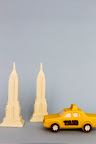Edible white Empire State Buildings for the bride and groom, and taxis by Martine’s Chocolates are the perfect party favor for a NYC-inspired wedding.