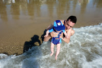 Getting my toes wet. But it's too cold for me!