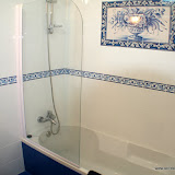 Bathroom detail with hand painted tile panel