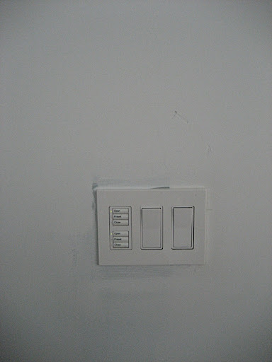 The wall switch in the dining room has both motorized shade and light controls for the dining room and living room. Lutron (www.lutron.com) makes a great selection of dimmer switches.  I know I will definitely be adding some here.