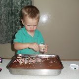 Putting sprinkles on Daddy's birthday cake