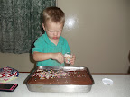 Putting sprinkles on Daddy's birthday cake