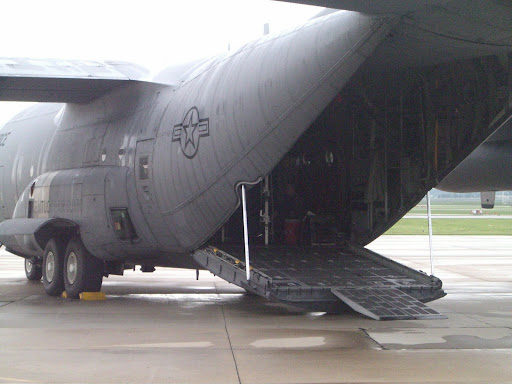 A C-130 cargo plane sits on the tarmac before mock patients are loaded onto the plane and flown away. (Photo credit: Jennifer Moore)