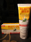 Burt's Bees makes great toothpastes with subtle mint and thick texture, 100% natural without flouride and 99.2% natural with it, all in convenient upright tubes. ($4.99 for 4 oz)