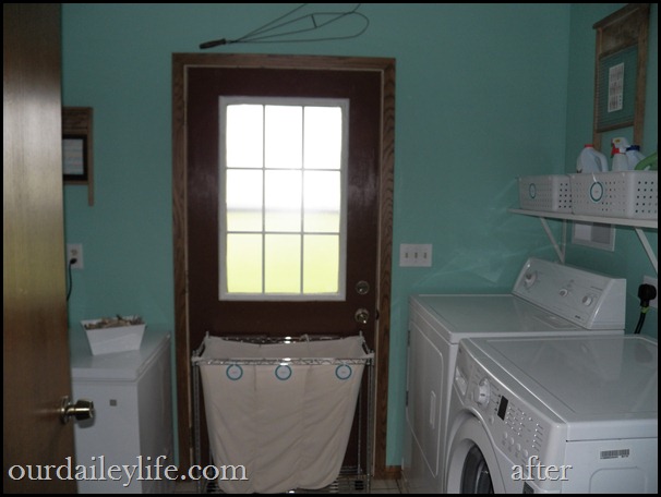 lndry aft 03 laundry room, white baskets, teal walls, vintage washboards as picture frames